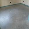 Before picture of a concrete floor with a clear sealer.